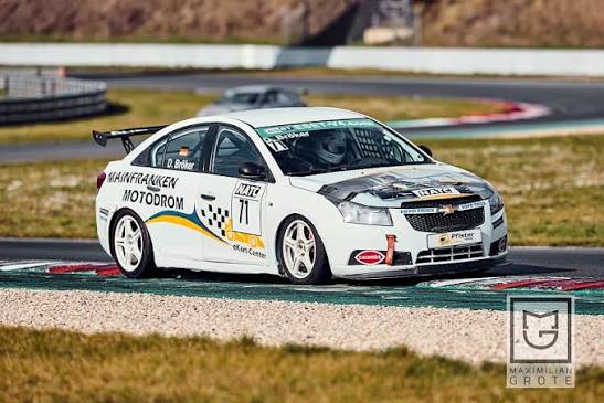 White Chevrolet Cruze race car number 71 in action on a racetrack